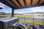 Relax after a day of adventure in your private hot tub with views of Eagle Lake & Big Mountain.